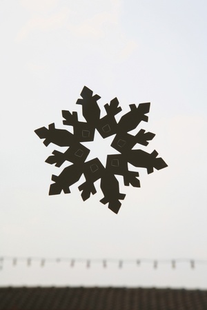 Paper snowlake on white backgroundの写真素材