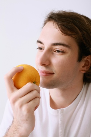 Man holding an orangeの写真素材