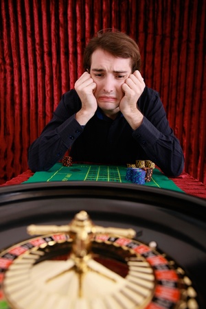 Man losing in roulette at casinoの写真素材