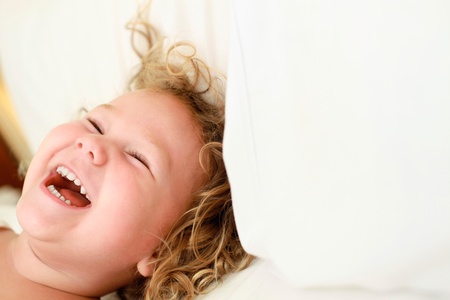 Close-up of little girl laughing