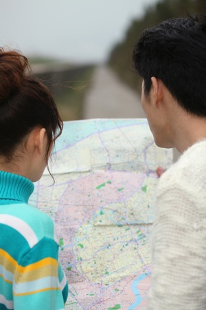Man and woman looking at a mapの写真素材