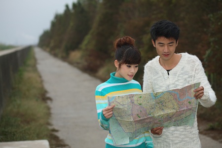 Man and woman looking at a mapの写真素材