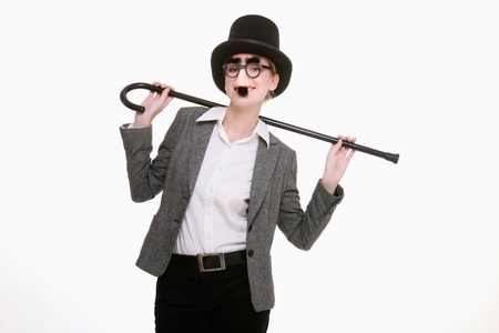 Businesswoman with funny disguise and dance caneの写真素材