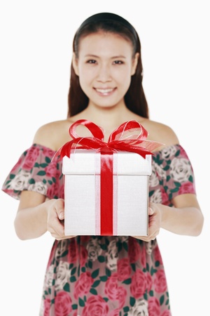 Woman with a box of wrapped giftの写真素材