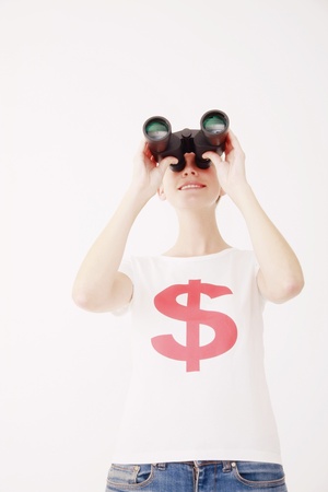 Woman looking through binocularsの写真素材