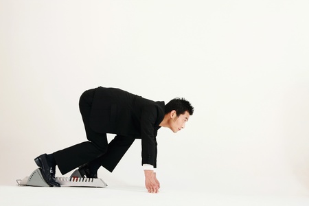 Businessman on starting blockの写真素材