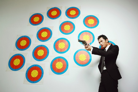 Businessman using gunの写真素材
