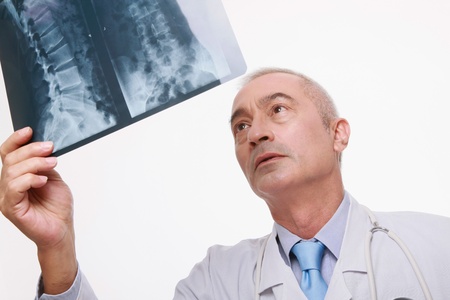 Doctor examining x-ray Doctor examining x-ray