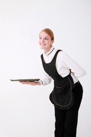 Waitress smiling while greetingの写真素材