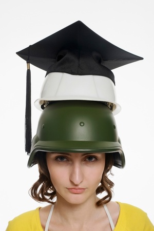 Woman wearing a stack of different hatsの写真素材