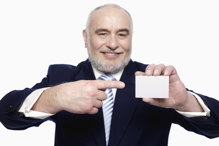 Businessman pointing at business cardの写真素材