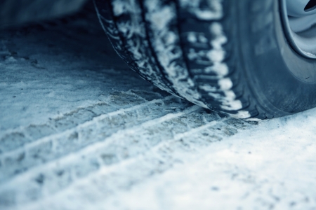 Car and tire track in the snow