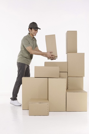 Man stacking up packagesの写真素材
