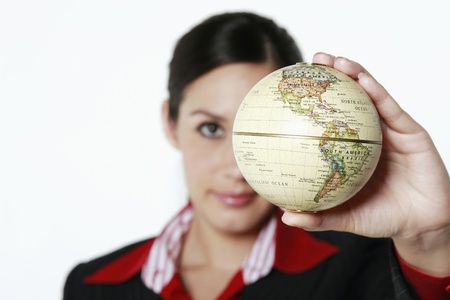 Businesswoman holding globeの写真素材
