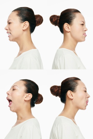 Montage of woman pulling different expressionsの写真素材