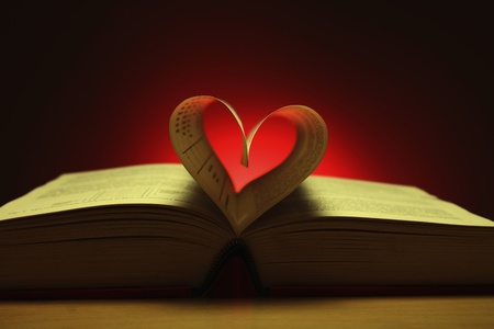 Heart shape formed from pages in bookの写真素材
