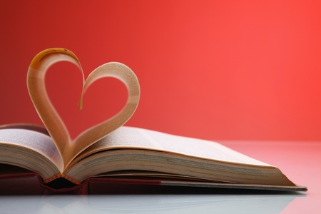 Heart shape formed from pages in bookの写真素材