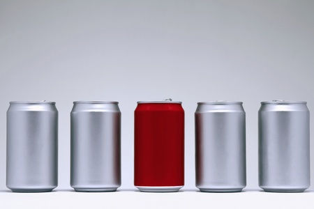 Single red can with silver cans の写真素材