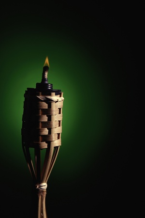 Burning light flame of Tiki torchの写真素材