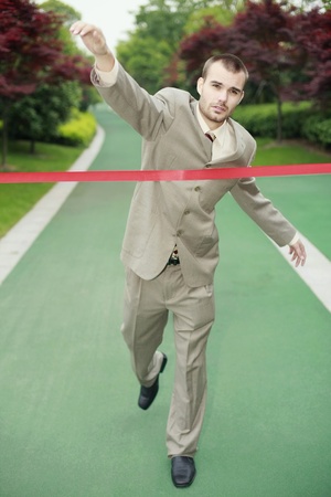 Businessmen racing towards the finish lineの写真素材