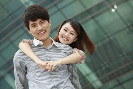 Woman with hands around man's neckの写真素材