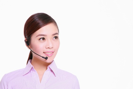 Businesswoman talking on telephone headset の写真素材