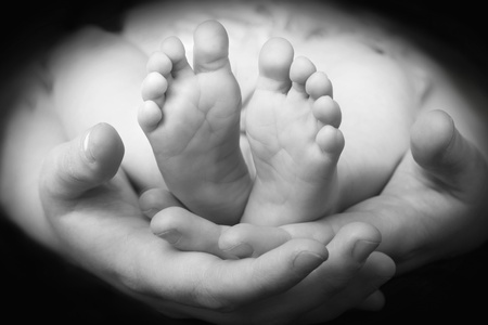 Mother showing baby's feetの写真素材