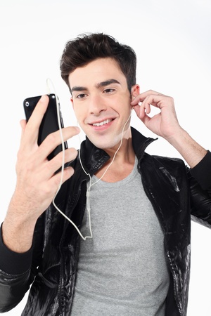 Man listening to music on MP3 playerの写真素材