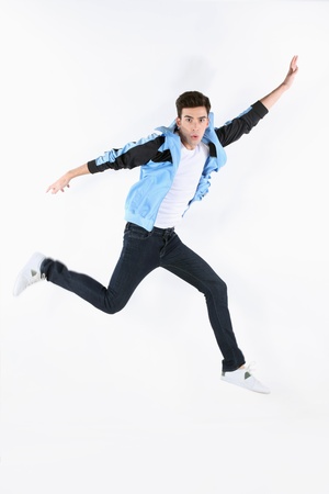 Man in blue jacket jumpingの写真素材