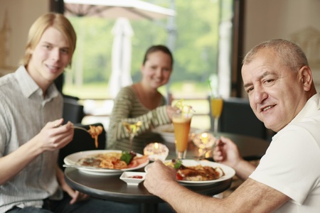 Men and woman having lunch together