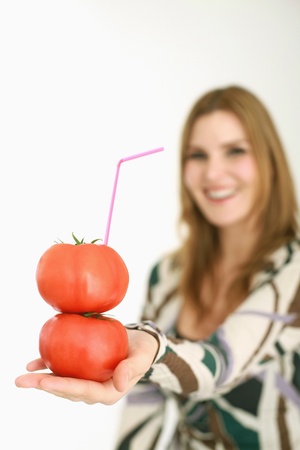 Woman drinking fresh tomato juiceの写真素材