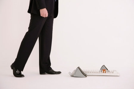 Businessman walking towards starting blockの写真素材