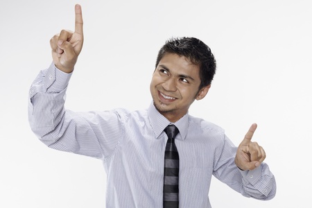 Businessman holding up index fingersの写真素材