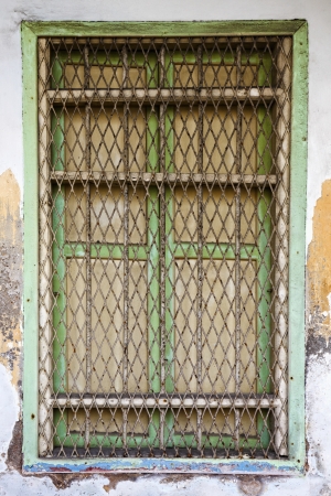 Closed window with grillの写真素材