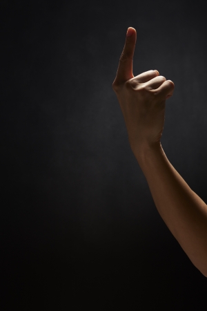 Index finger pointing upwardsの写真素材