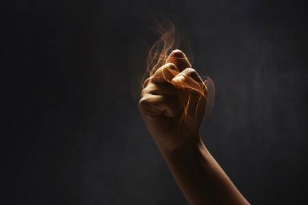 Human hand showing punching gestureの写真素材