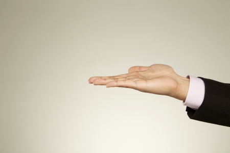 Person holding out his palmの写真素材