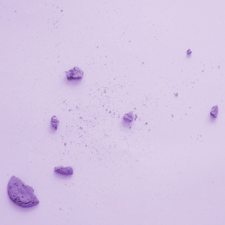 Broken pieces of cookie on pastel backgroundの写真素材