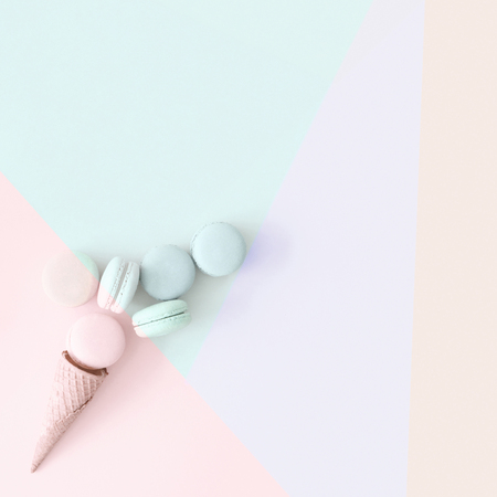 Macarons and wafer cone on pastel backgroundの写真素材