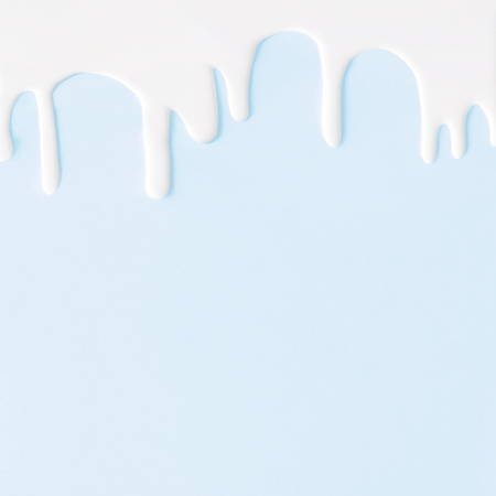 Liquid flowing down concept on pastel backgroundの写真素材