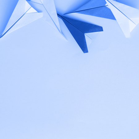 Paper planes on pastel backgroundの写真素材