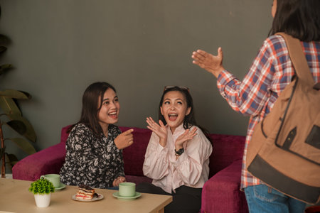 Woman meeting up with her friends at a cafe