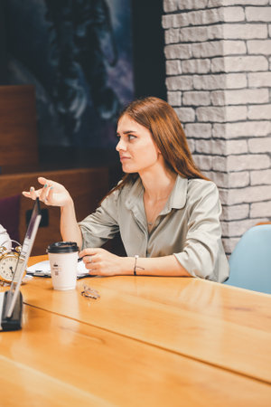 Young adults in office attire having a meeting
