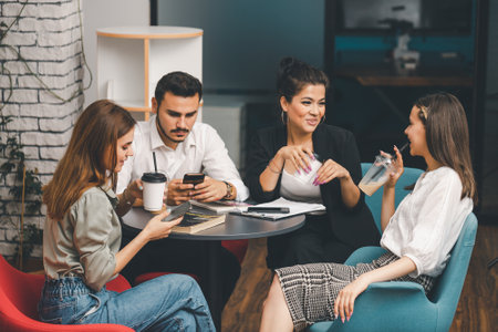 Young adults in office attire having a break
