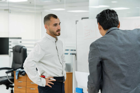 Young businessmen having a discussion while working