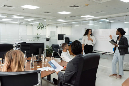 Young businesspeople having a discussion while working