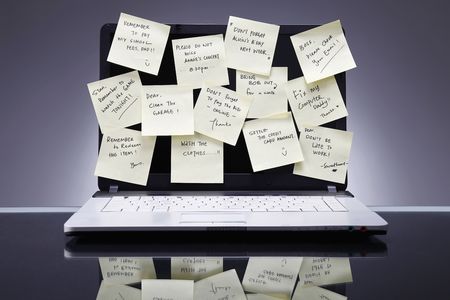 Adhesive notes on laptop screen