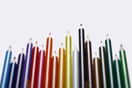 Coloured pencils arranged in a rowの写真素材