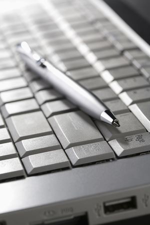 Pen on laptopの写真素材