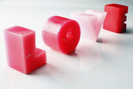 Love spelt in red and pink candlesの写真素材